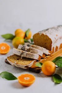 sliced bread with sliced orange fruit on white ceramic plate