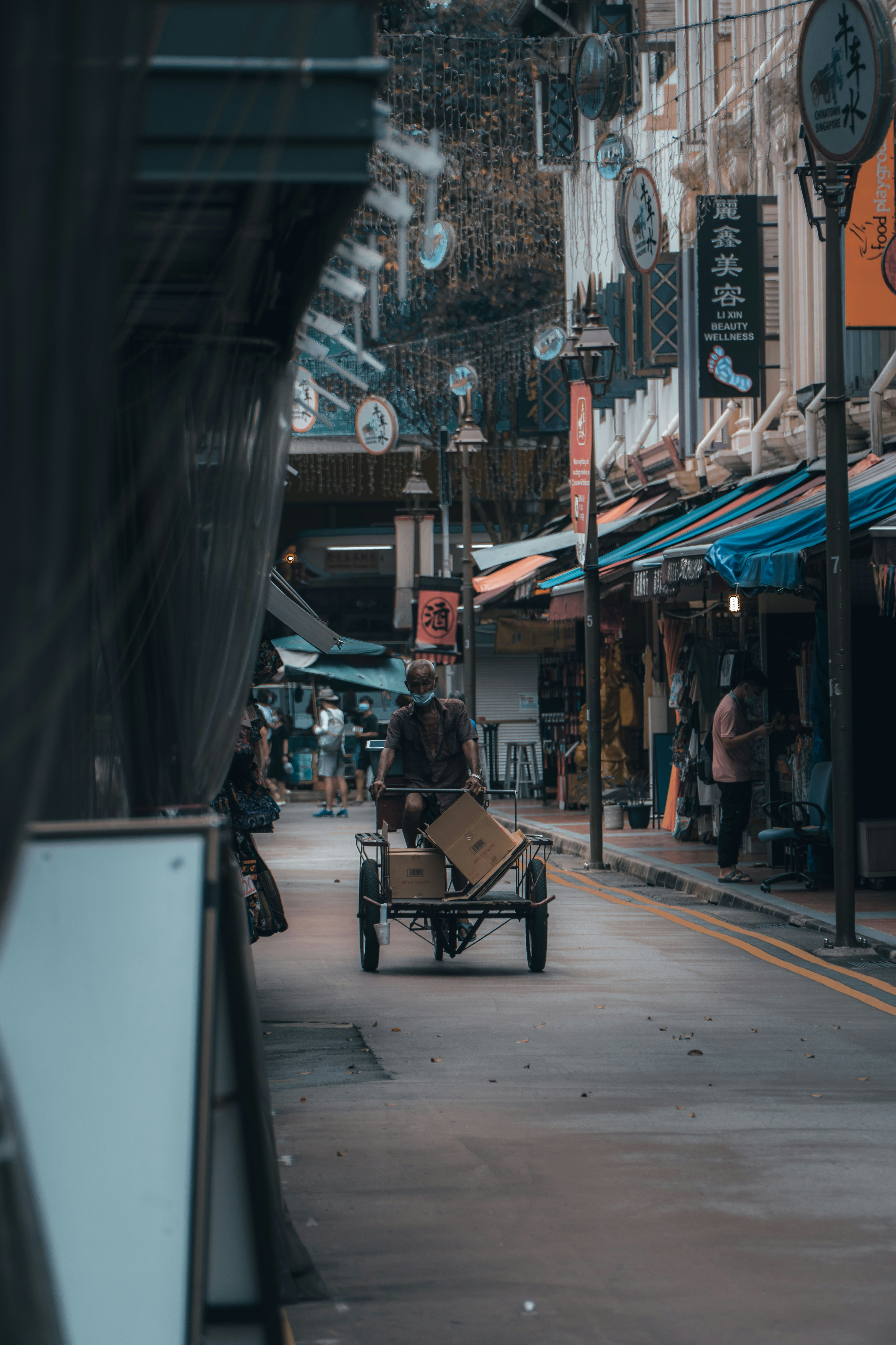 people sitting on chair near store during daytime