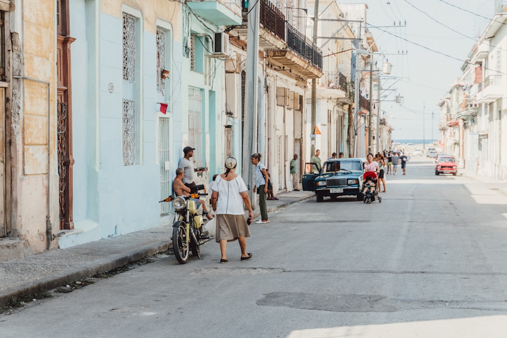 man in blue shirt riding bicycle during daytime