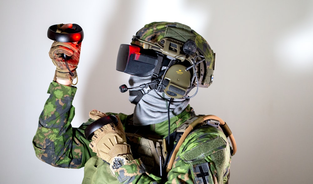 man in green and brown camouflage uniform