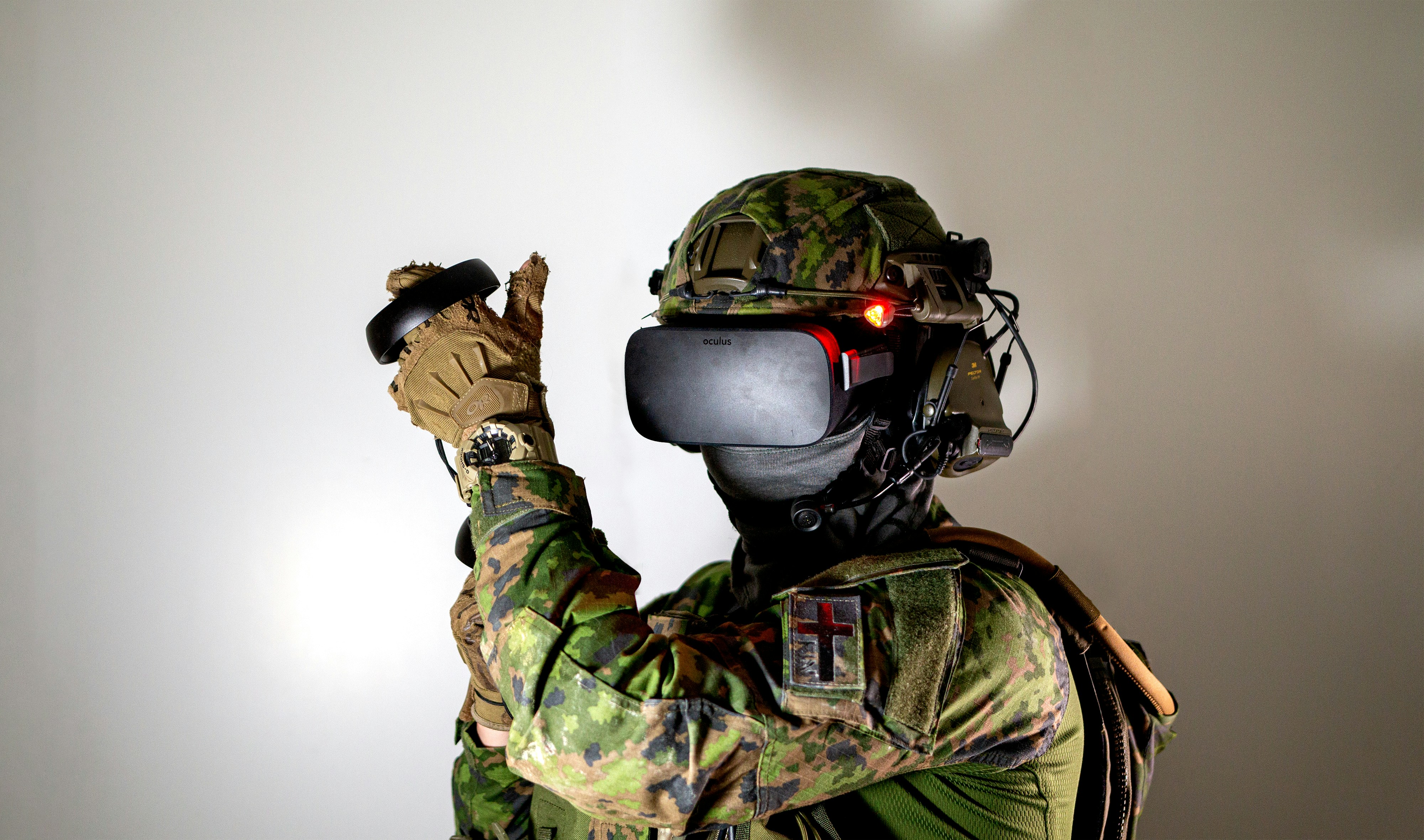 man in green and brown camouflage suit wearing black helmet