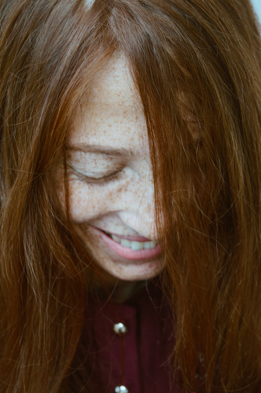 woman in red shirt smiling