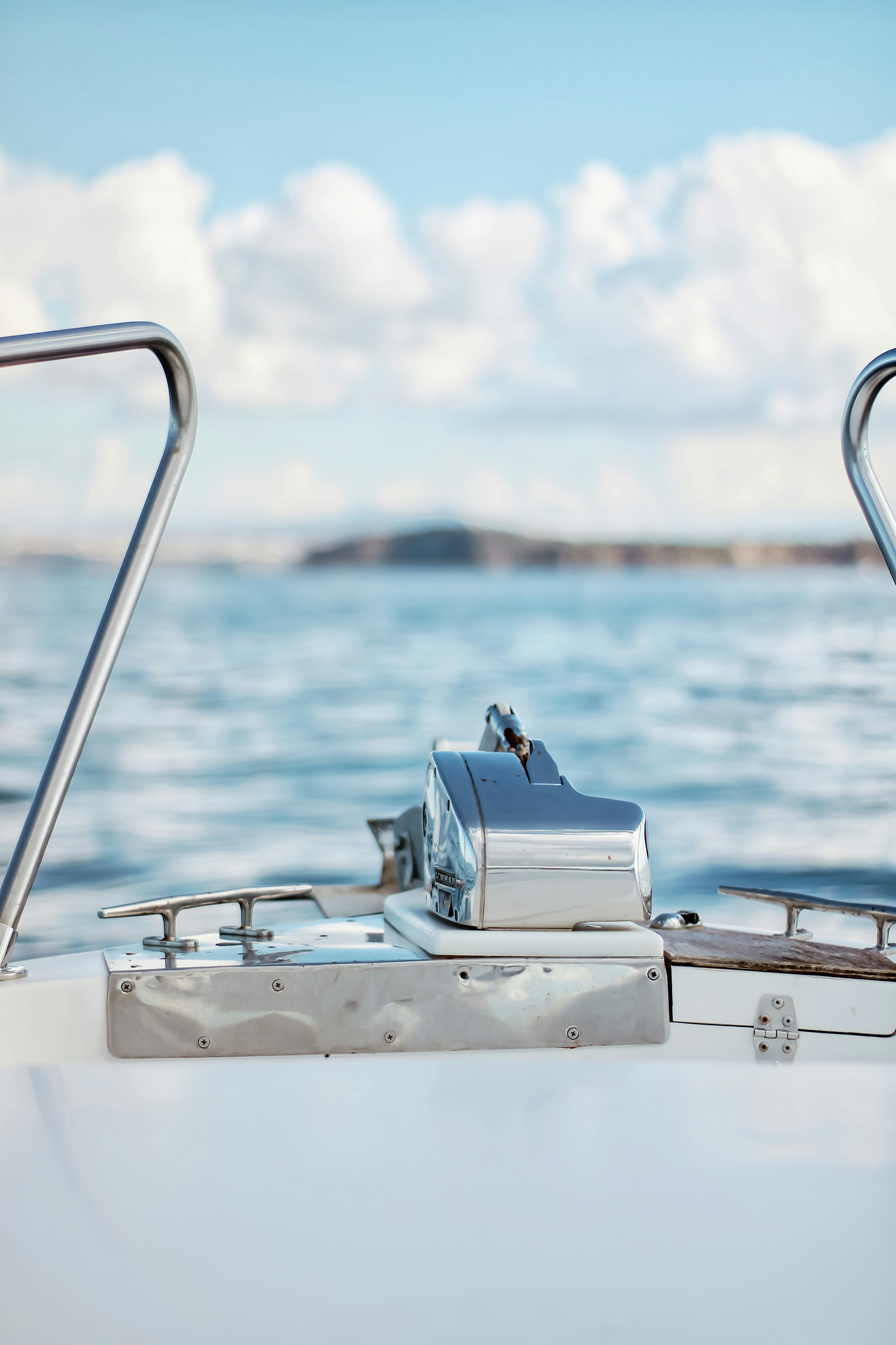 white and black motor boat on sea during daytime