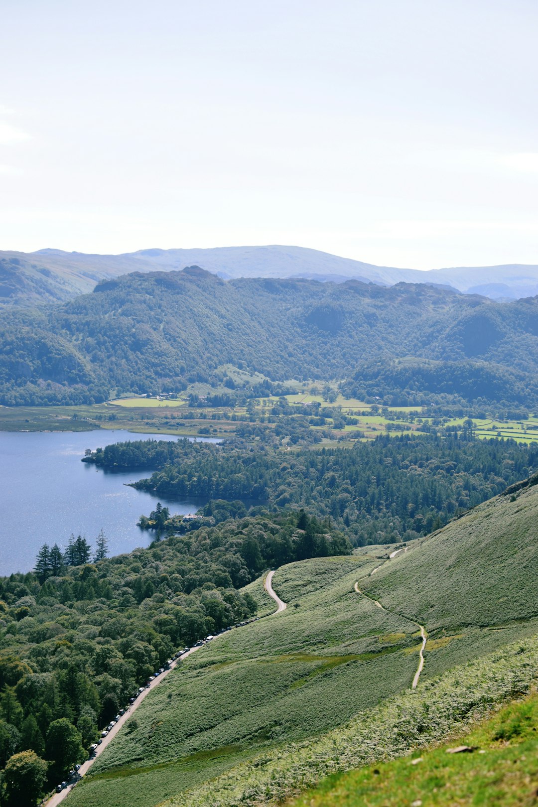 green mountains near body of water during daytime