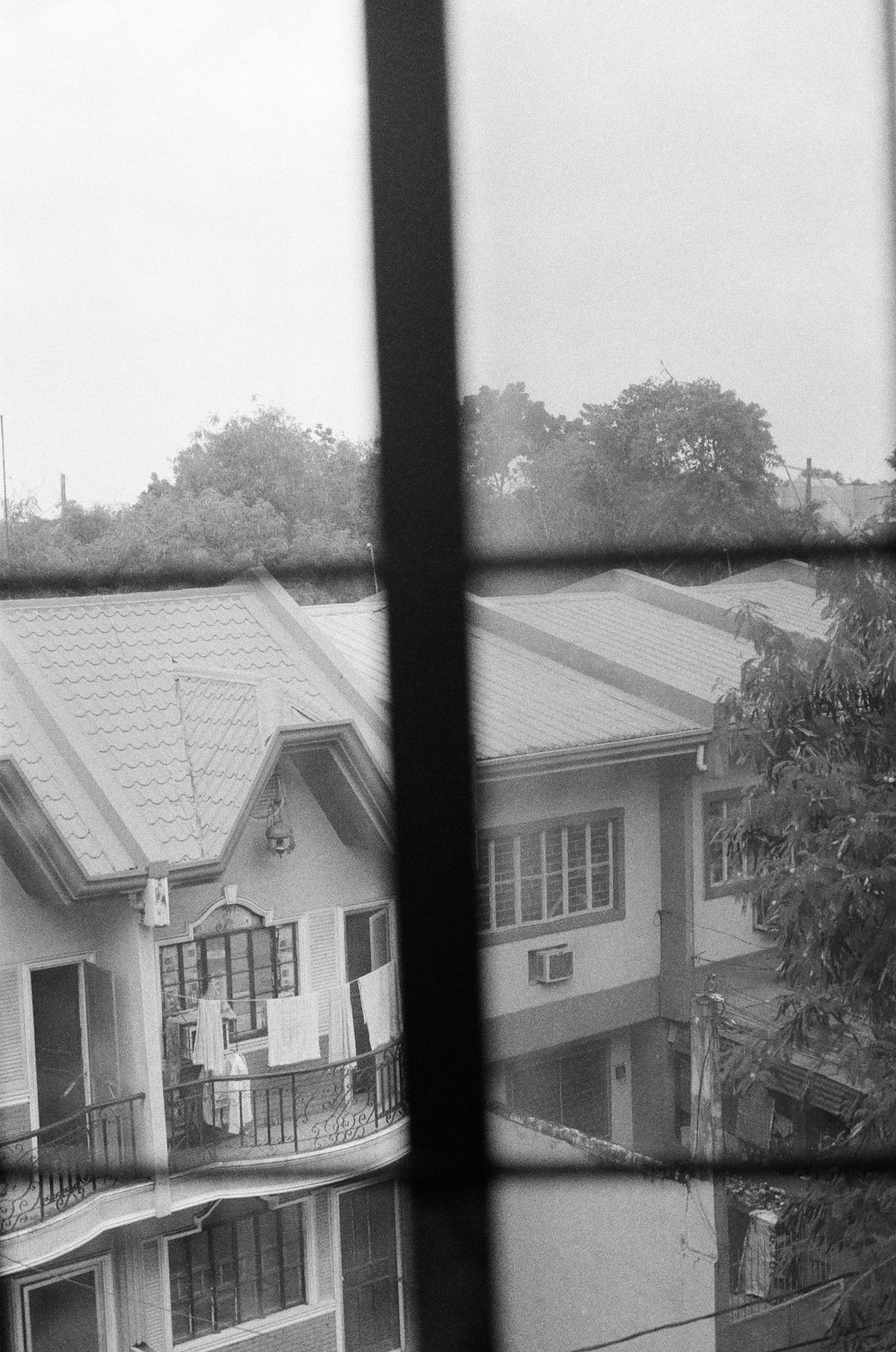 grayscale photo of 2 storey house