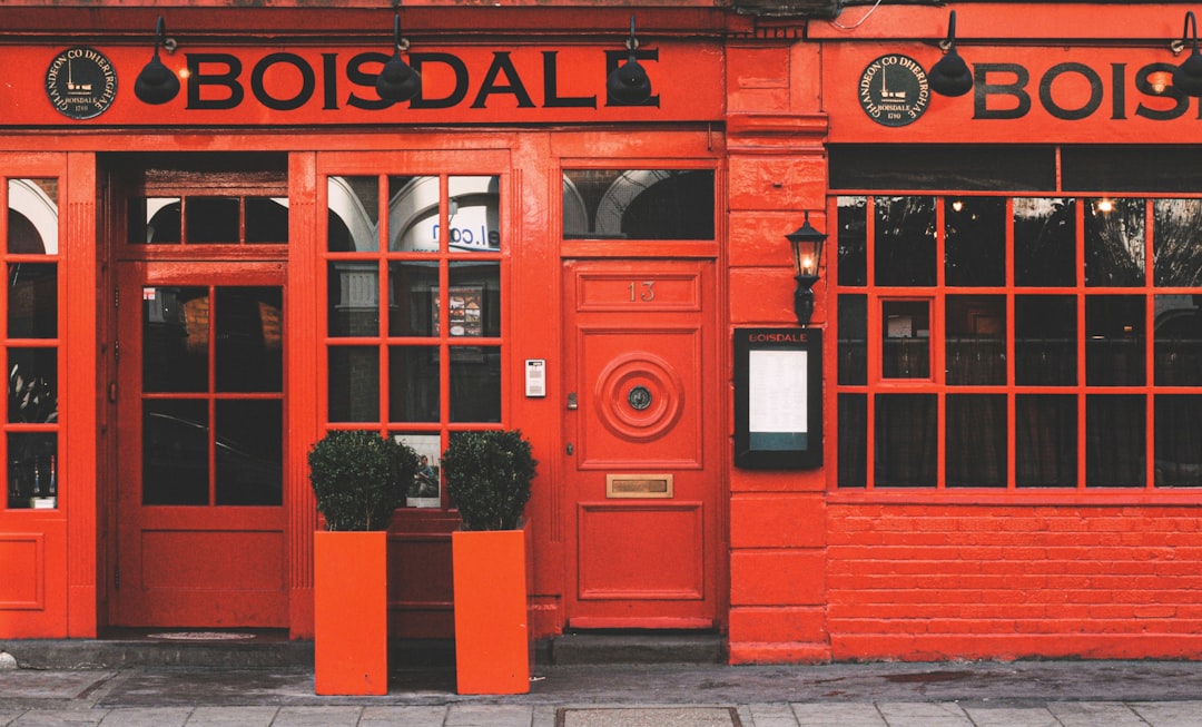 red wooden door with red and white flowers