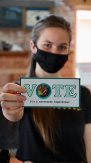 woman holding white and blue box