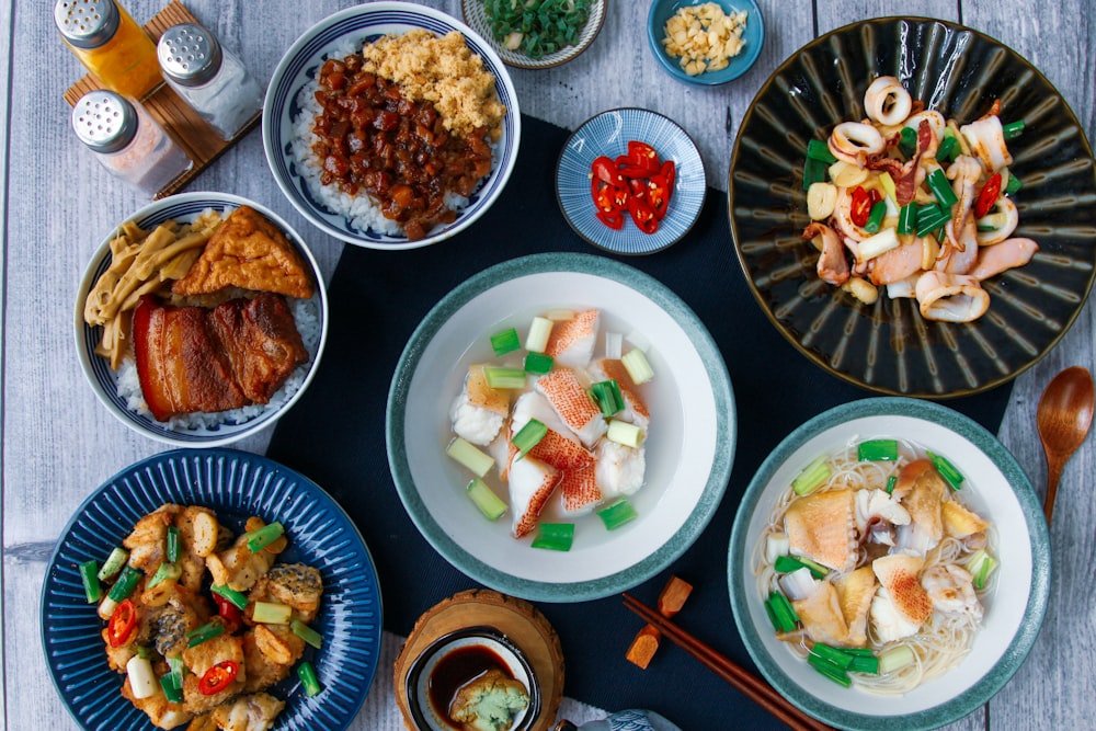 assorted food on blue ceramic plates