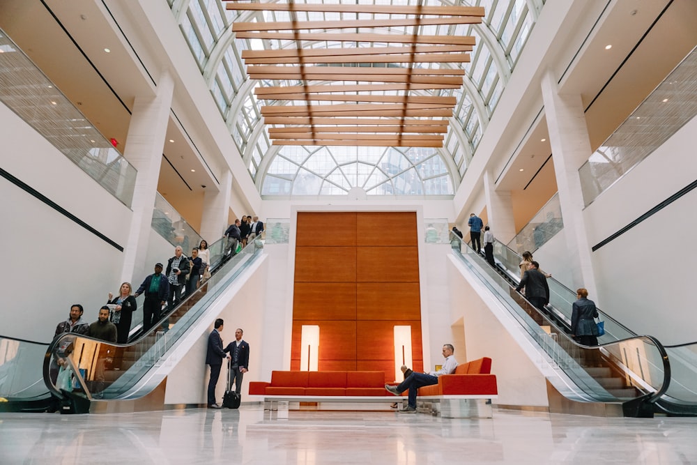 people sitting on bench inside building