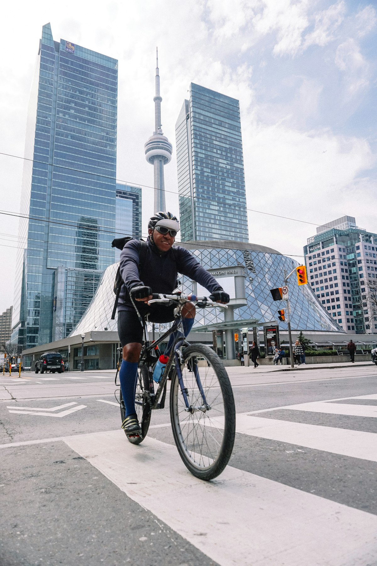 Delivery driver on a bicycle carrying food orders through a city street