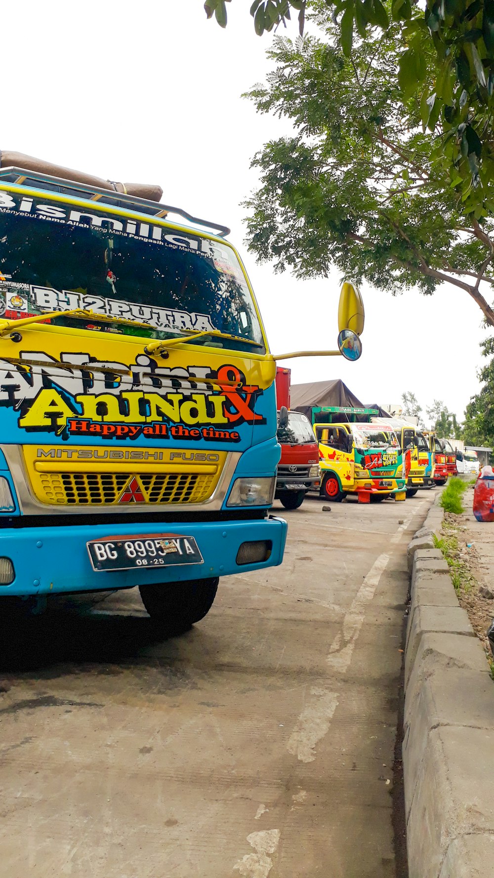 blue and yellow van on road during daytime