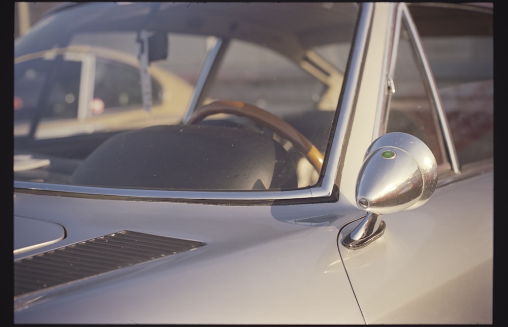 silver car with side mirror