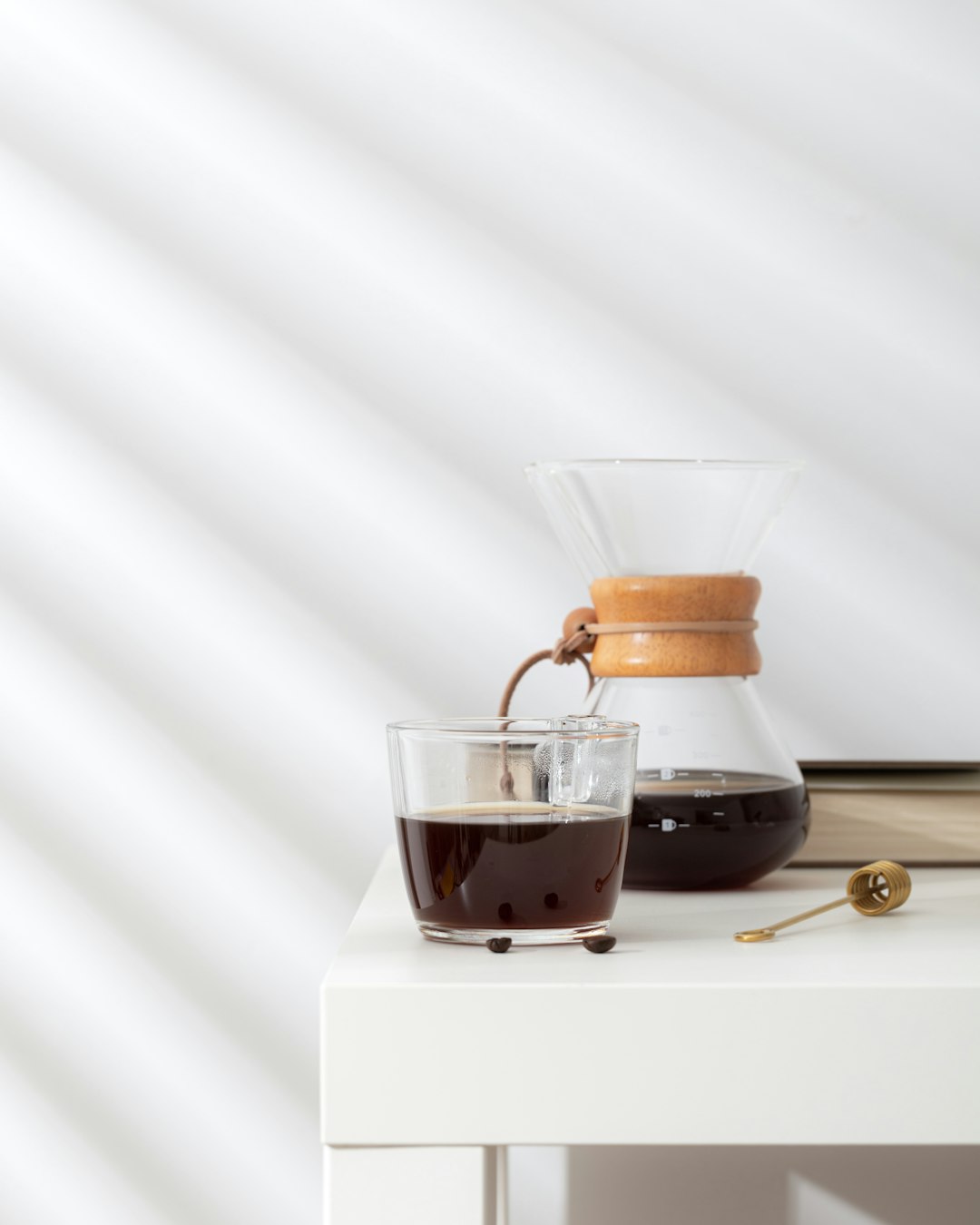 clear glass cup with brown liquid