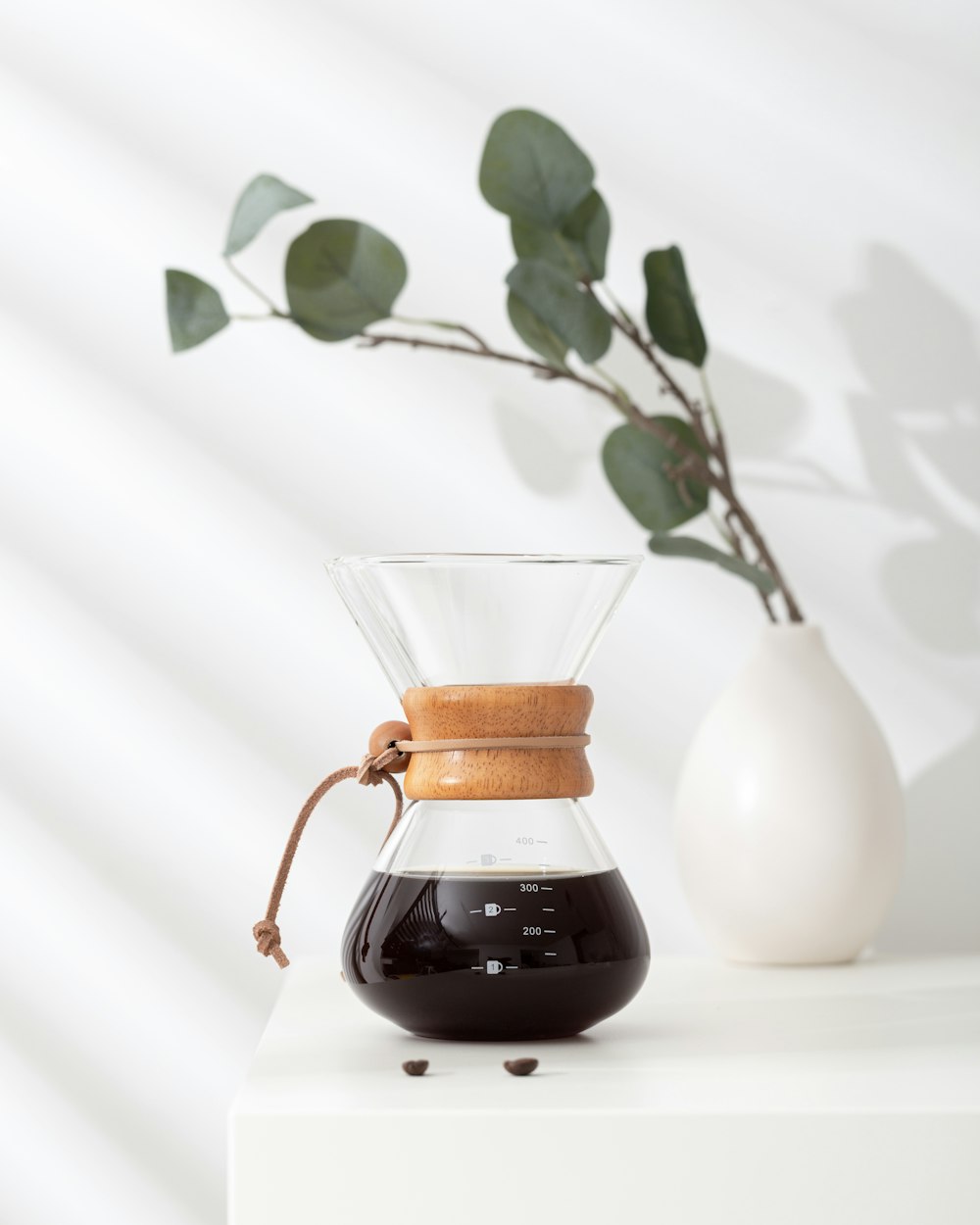 white ceramic vase with brown liquid