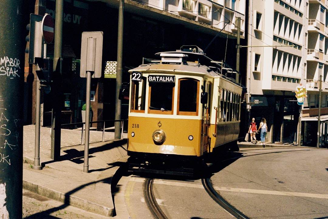 yellow and white tram on road during daytime