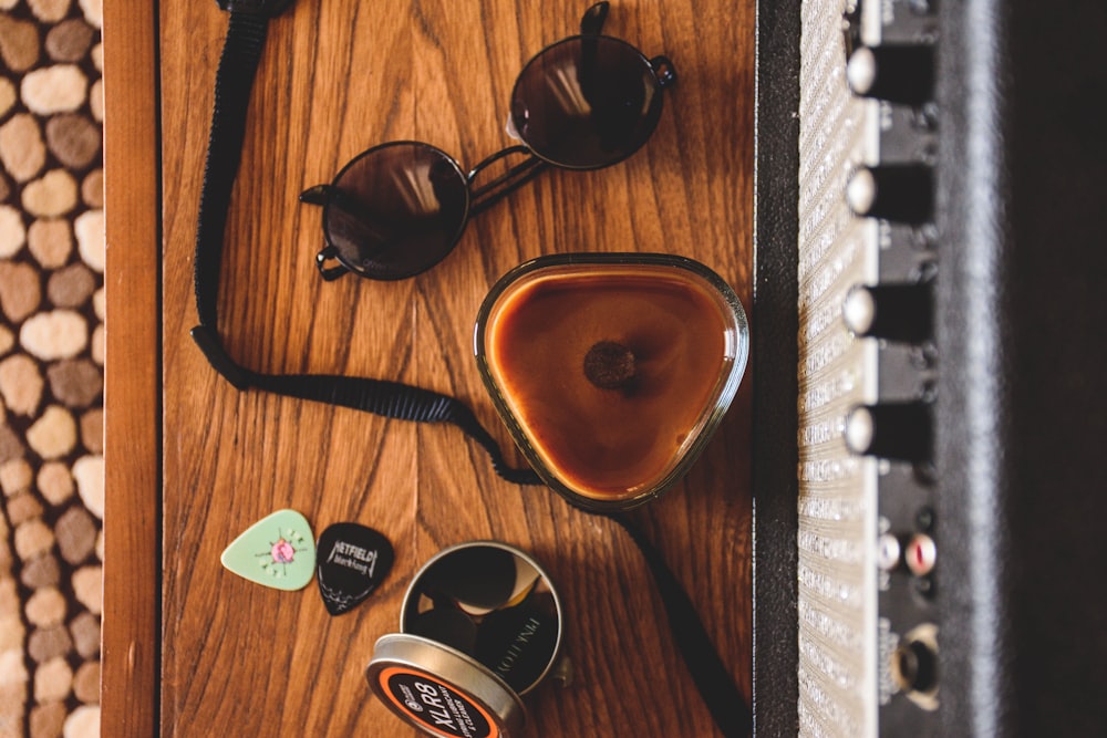 brown sunglasses on brown wooden table