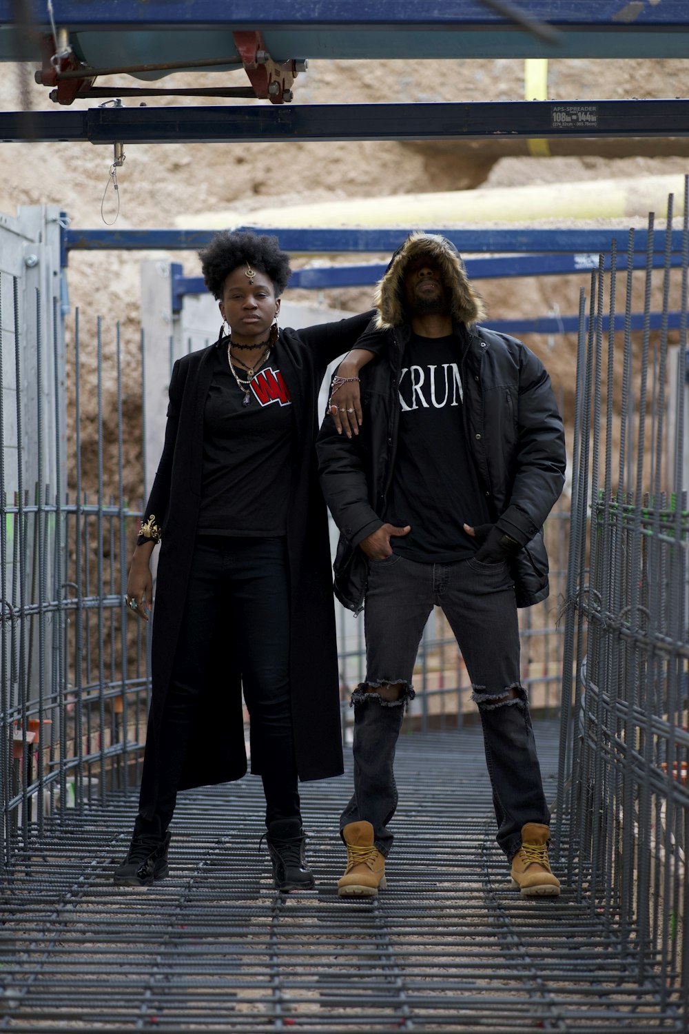 man in black coat standing beside woman in black coat