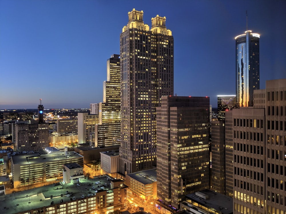 city with high rise buildings during night time