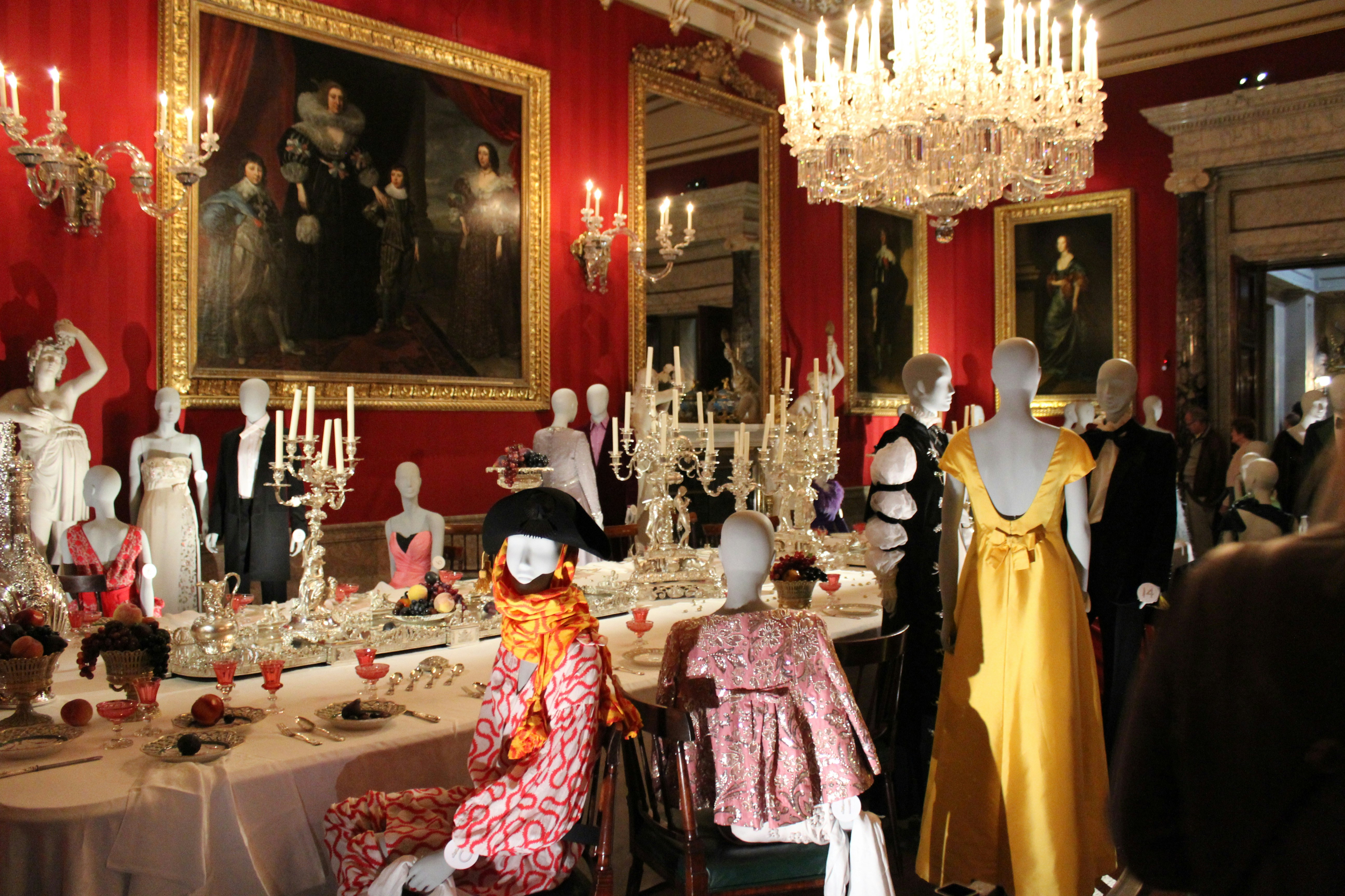 woman in yellow dress standing beside table
