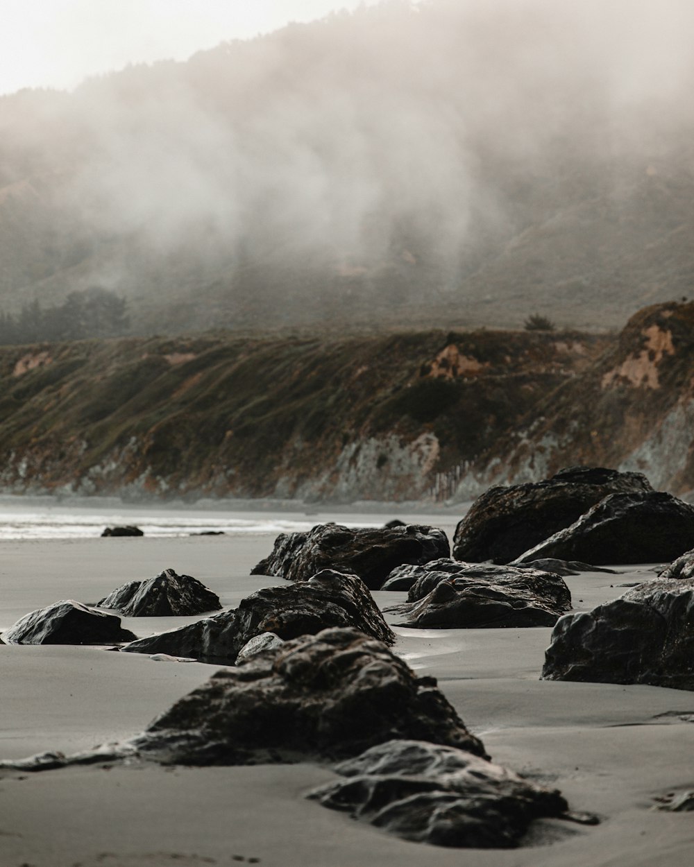 rocky shore with sea waves crashing on rocks