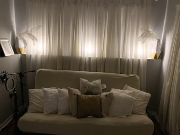 A cozy living room setup for an intimate singing gram surprise performance.