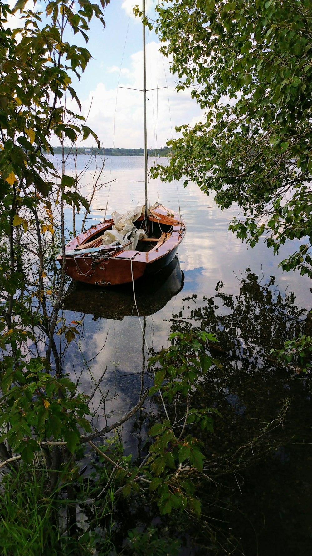 brown boat on water during daytime