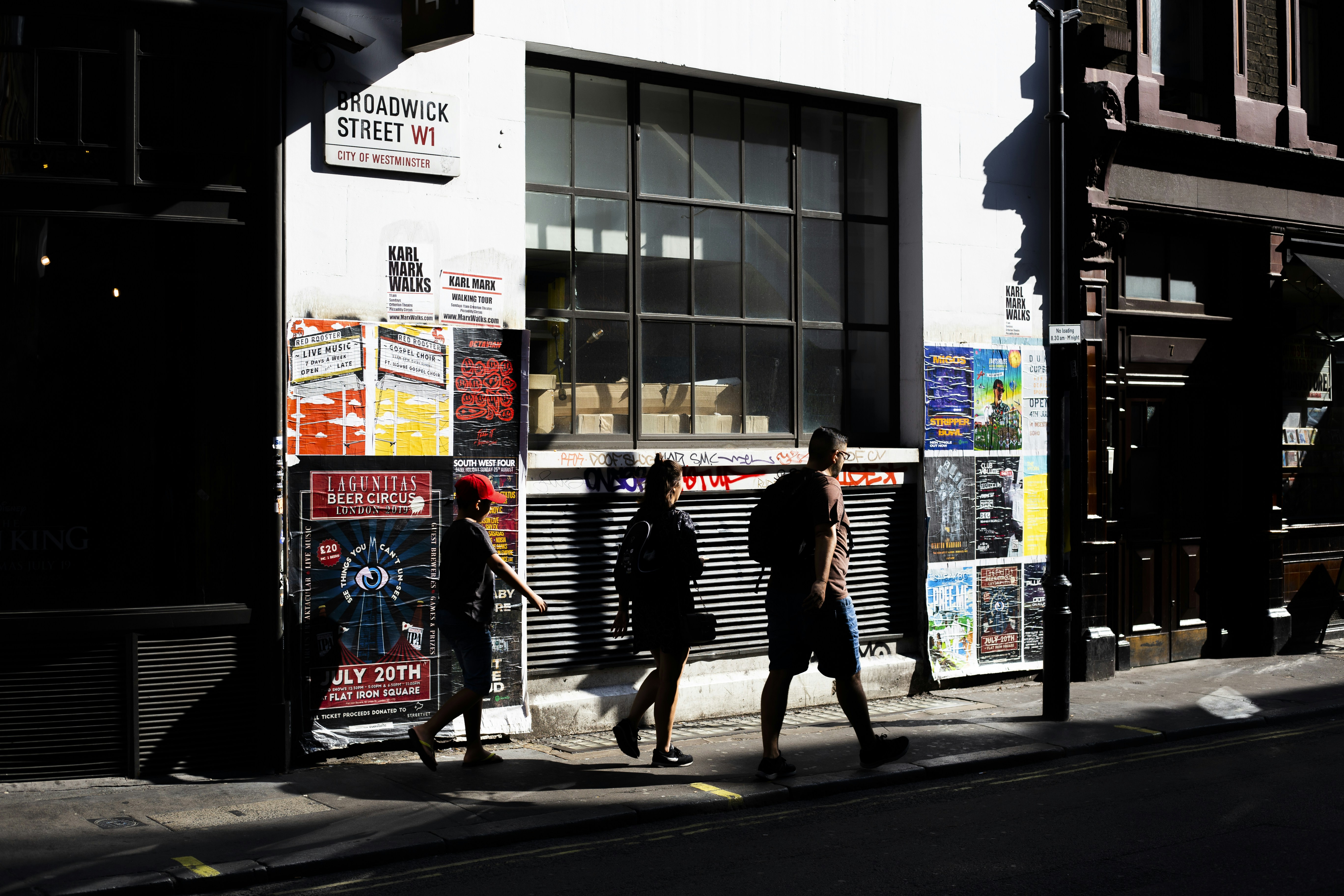 people walking on sidewalk during daytime