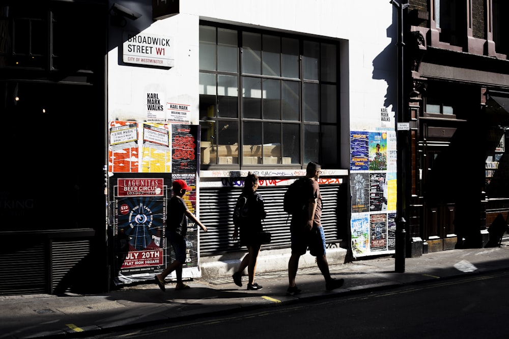 people walking on sidewalk during daytime