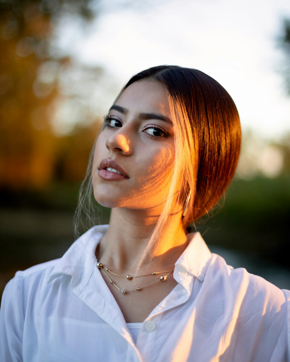 woman in white button up shirt