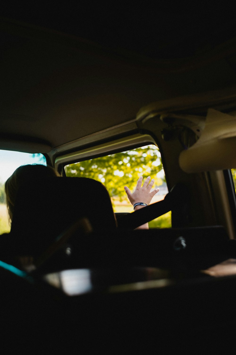 person sitting on car seat