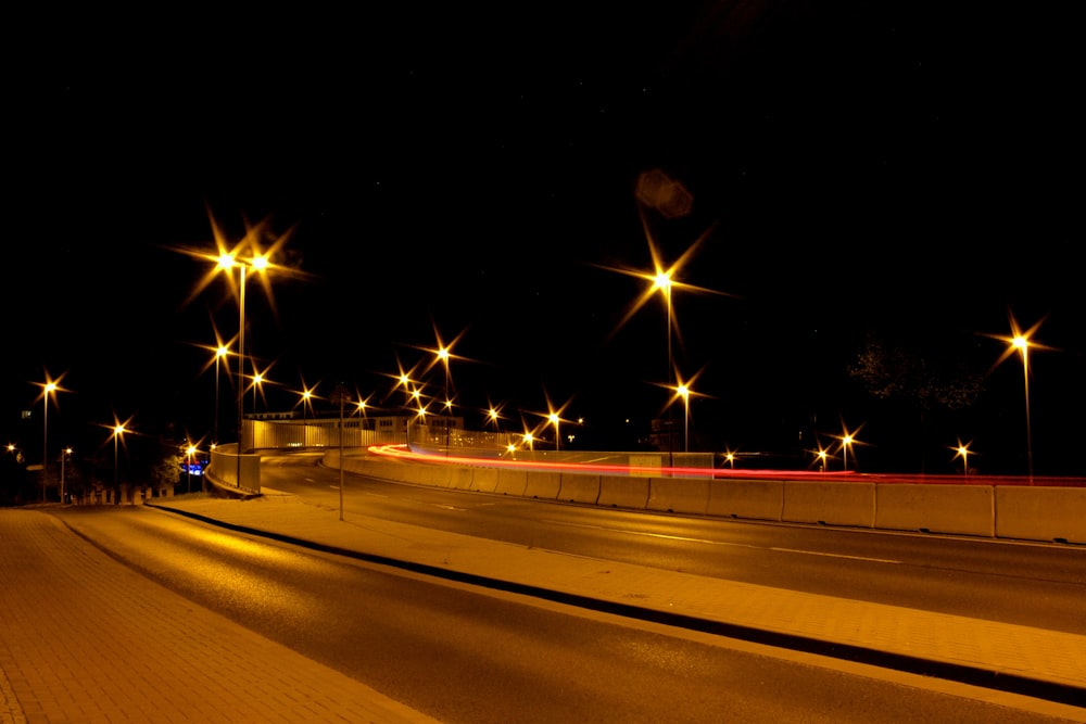 time lapse photography of cars on road during night time