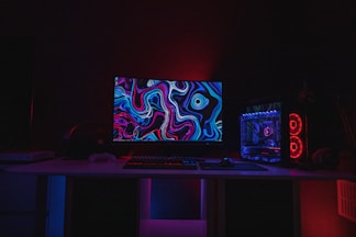 black flat screen computer monitor turned on displaying desktop