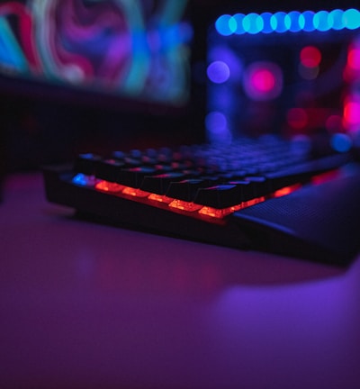 black computer keyboard on brown wooden table