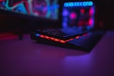 black computer keyboard on brown wooden table