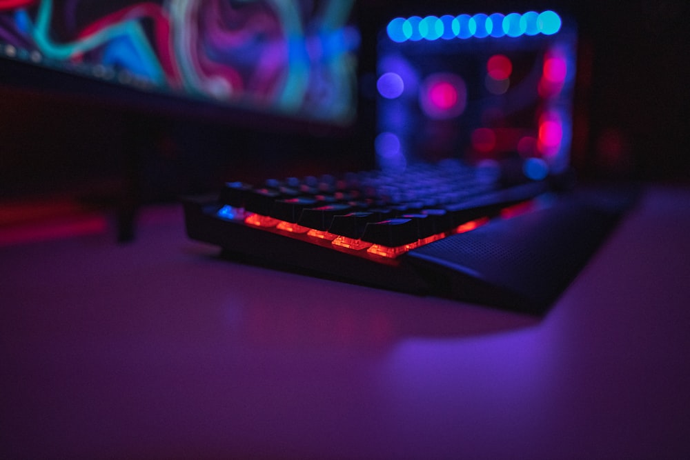 black computer keyboard on brown wooden table