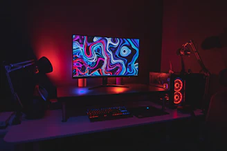 black flat screen computer monitor turned on near black computer keyboard