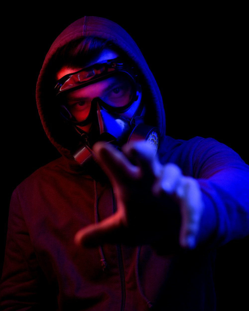 person in purple hoodie wearing mask