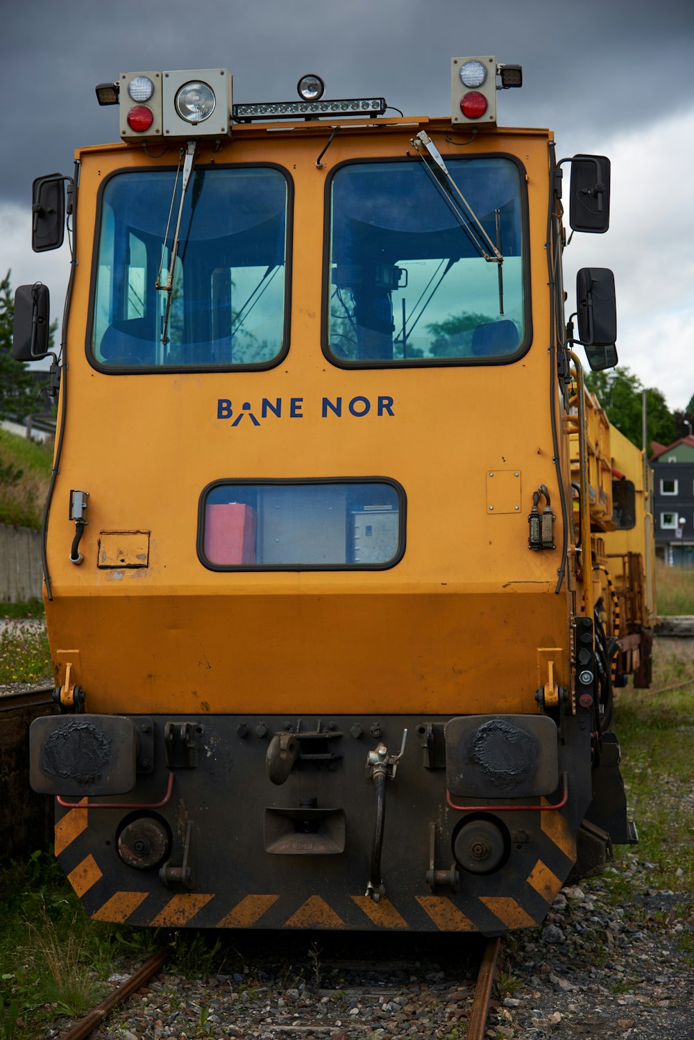 yellow and purple train on rail tracks