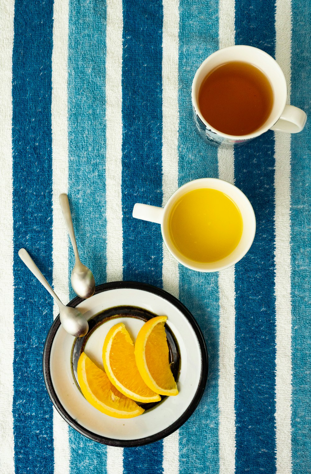 white ceramic mug with yellow liquid