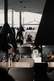people sitting on chair near table during daytime