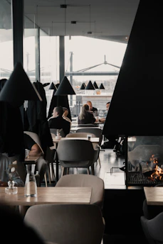 people sitting on chair near table during daytime