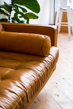 BY afsar sofa brown leather couch on white ceramic floor tiles