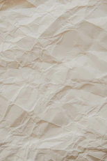 crumpled beige parchment paper texture