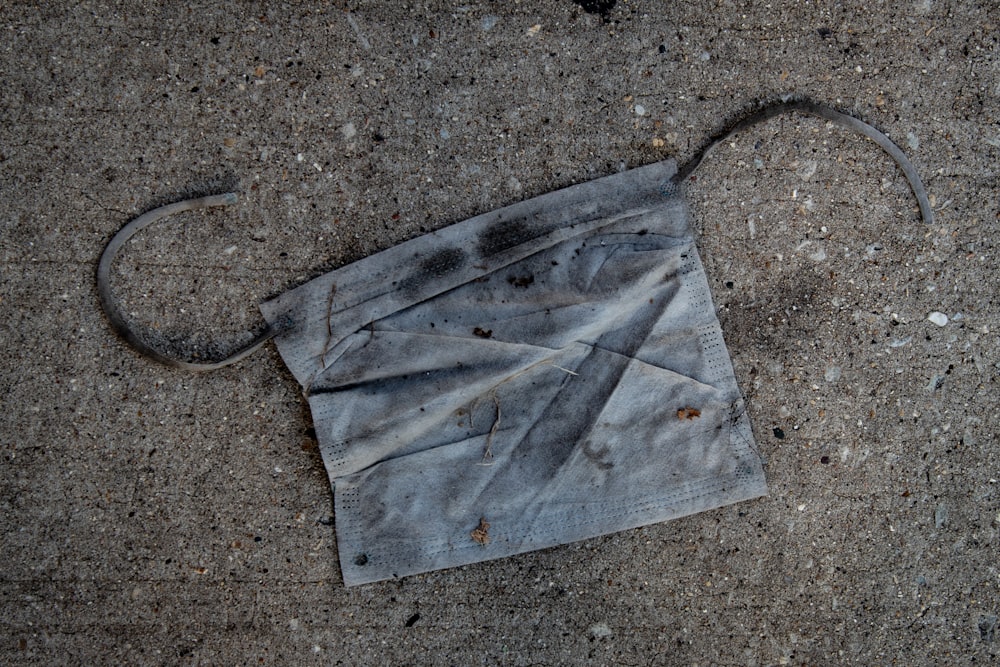 gray paper bag on gray concrete floor