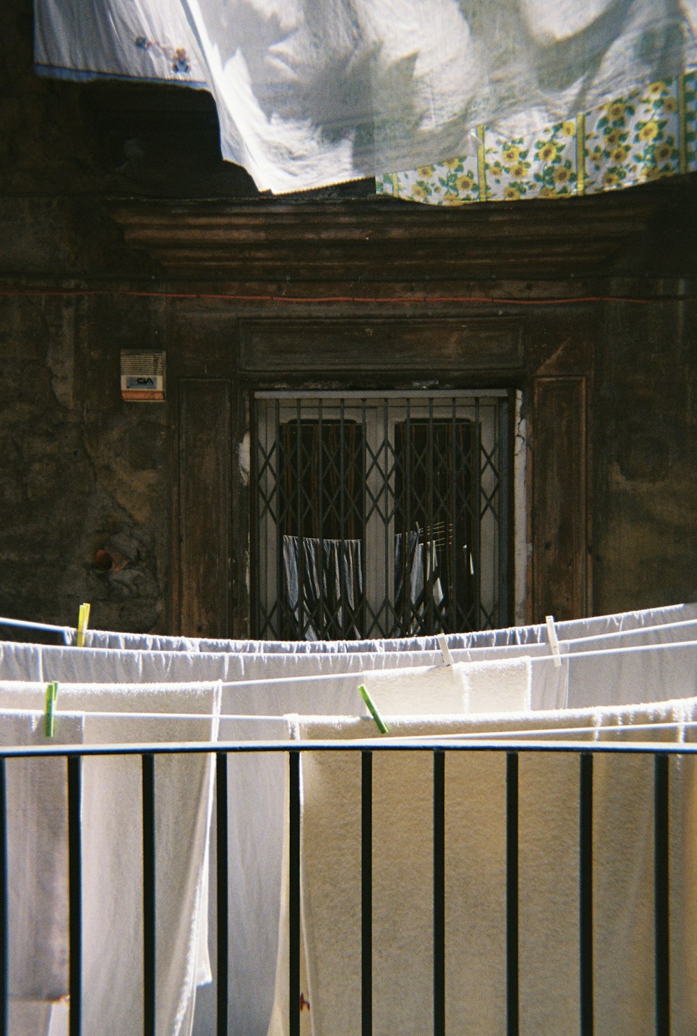 white metal railings near brown wooden door
