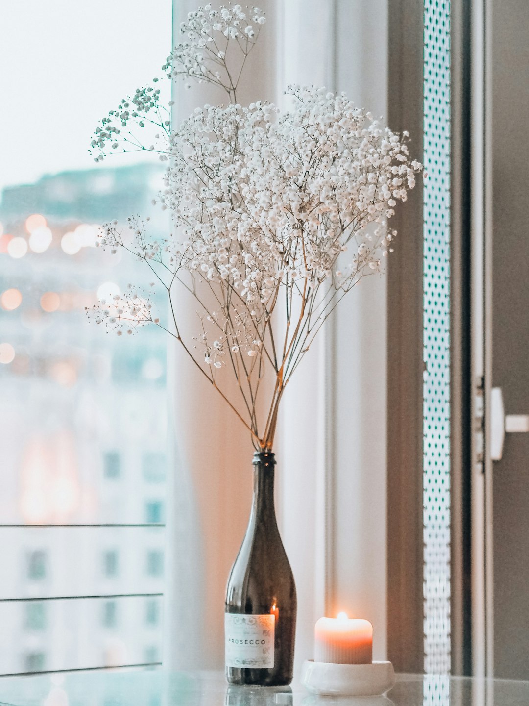 white flowers in brown vase