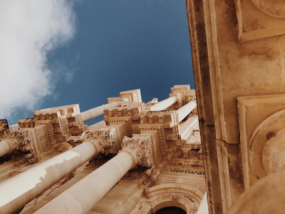 brown concrete building under blue sky during daytime