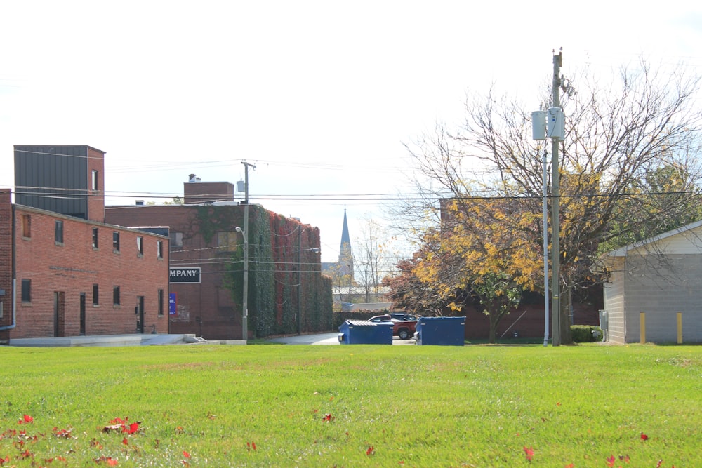 brown concrete building near green grass field during daytime