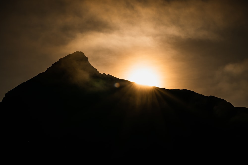 silhouette of mountain during sunset