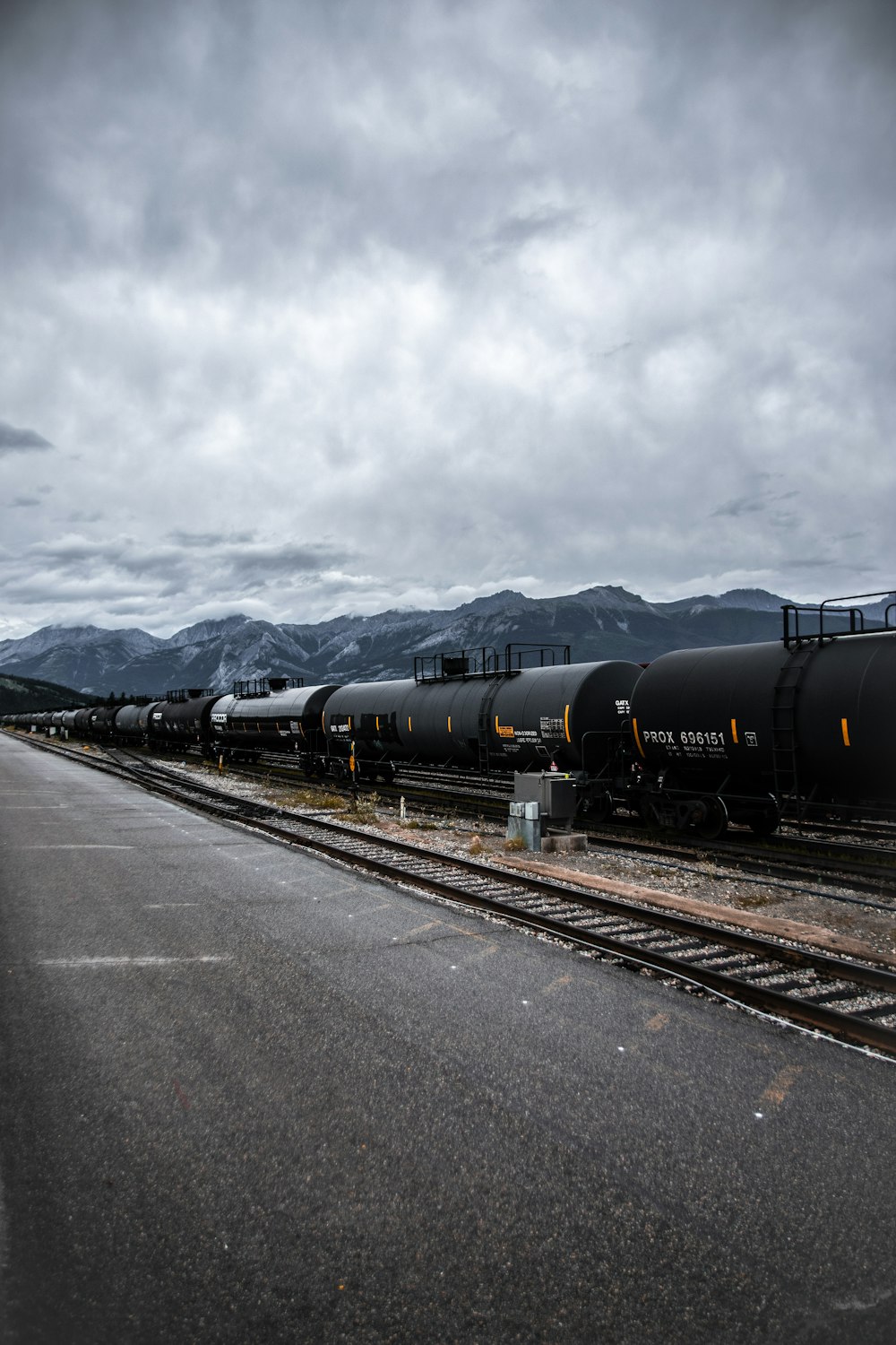 black train on rail road during daytime